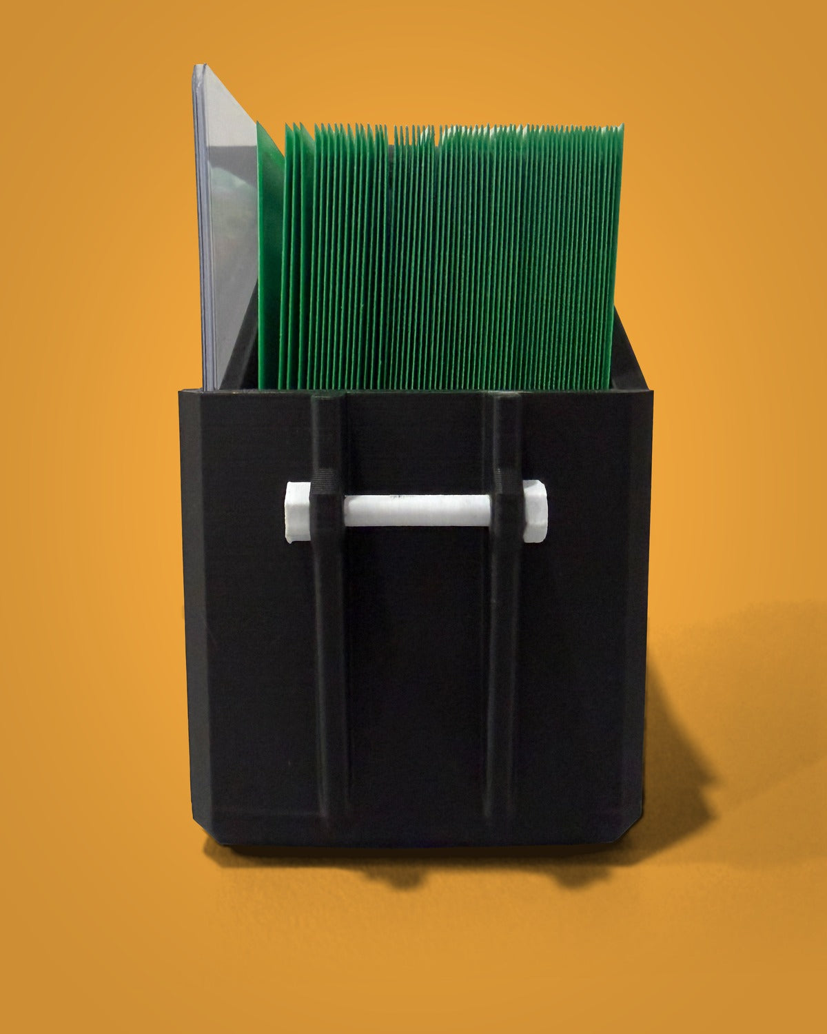 Juice Box v1 open, clip side, with a 60-card single-sleeved deck inside