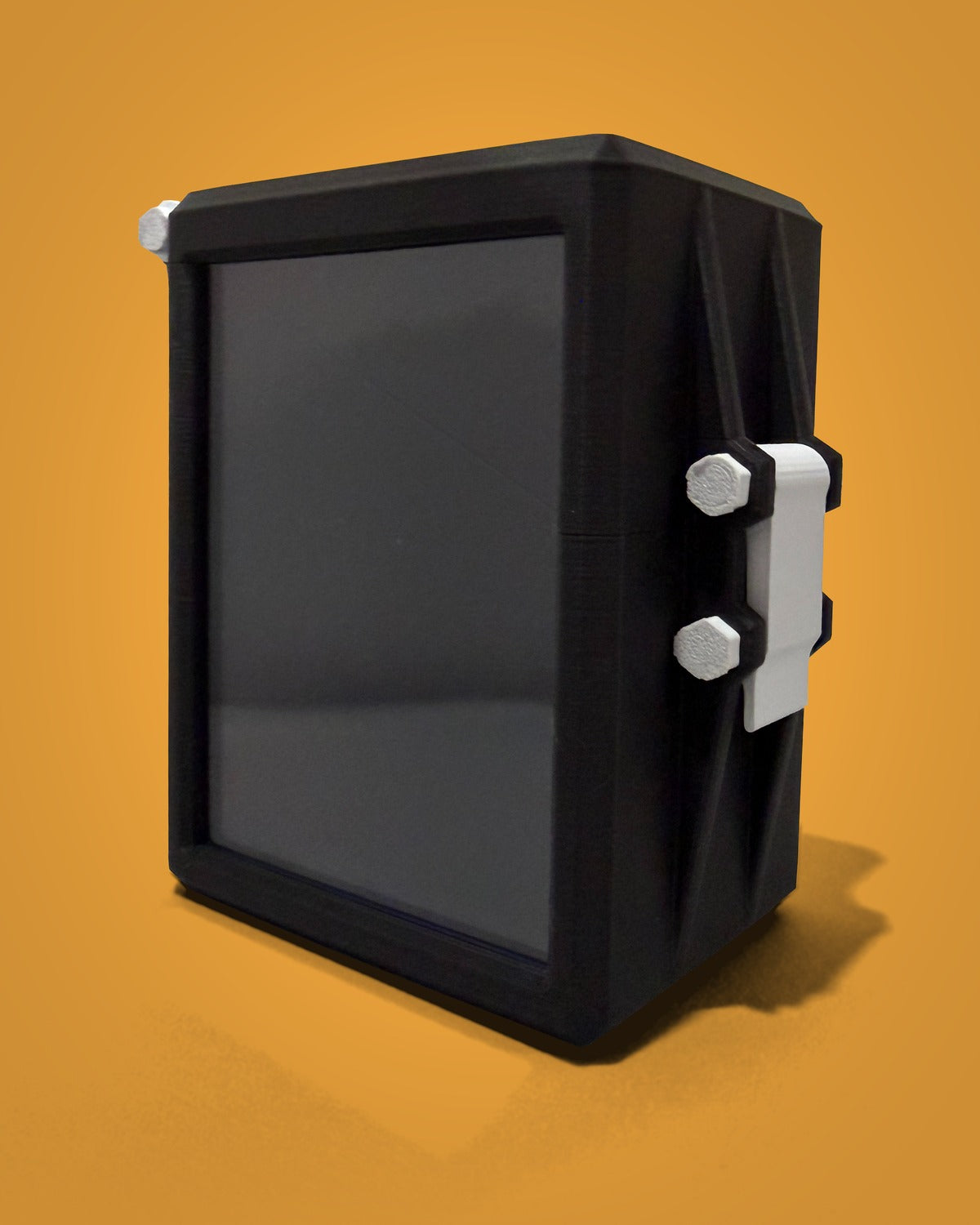 Juice Box v1 deck box in black, closed, three-quarter view of the display window